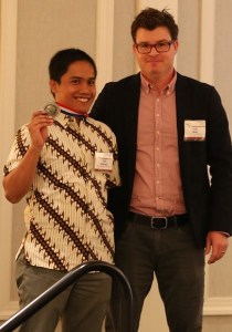 Sigit receiving the Spallanzani Medal from Craig Willis, chair of the Spallanzani Awards Committee (Photo copyright Sean Werle)
